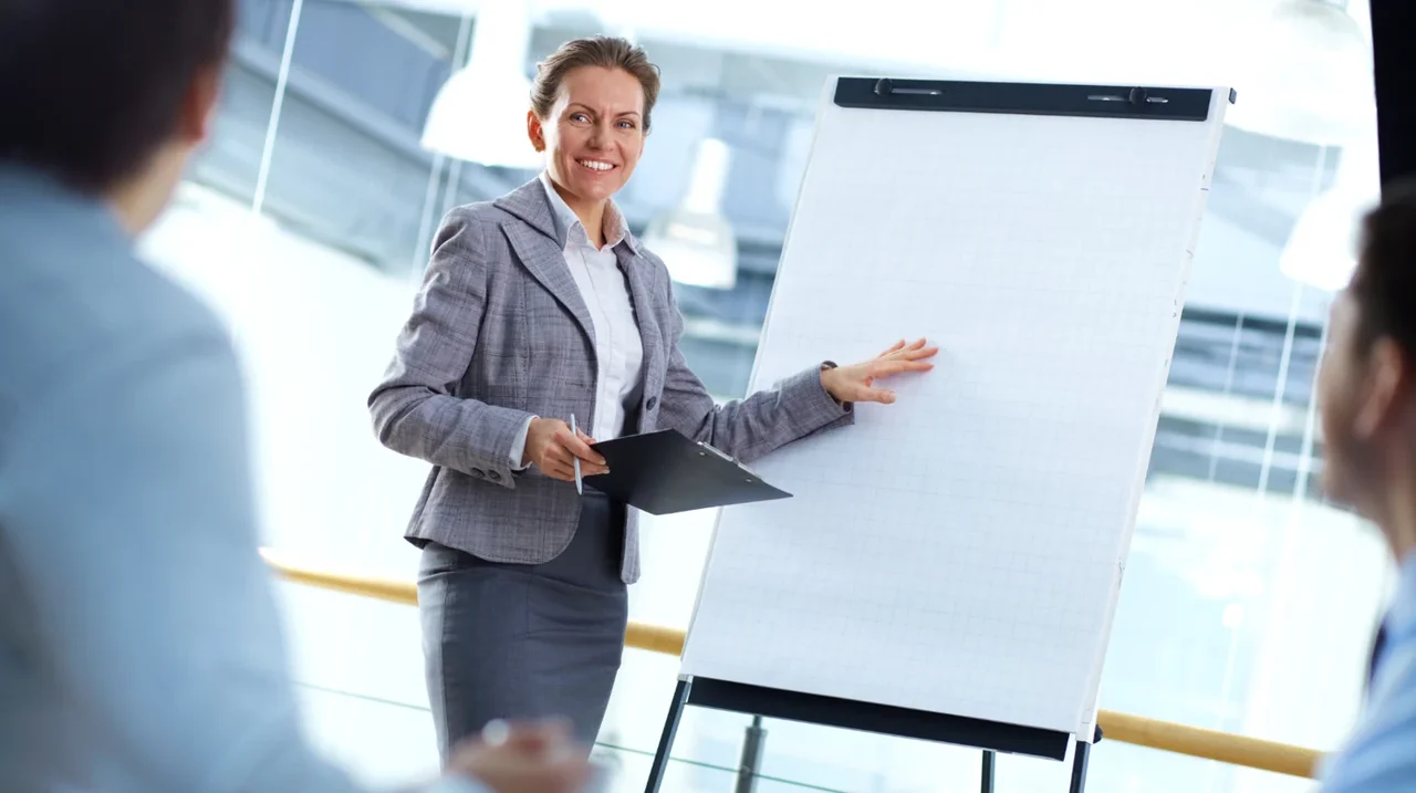 Professional explaining a chart at a team meeting.