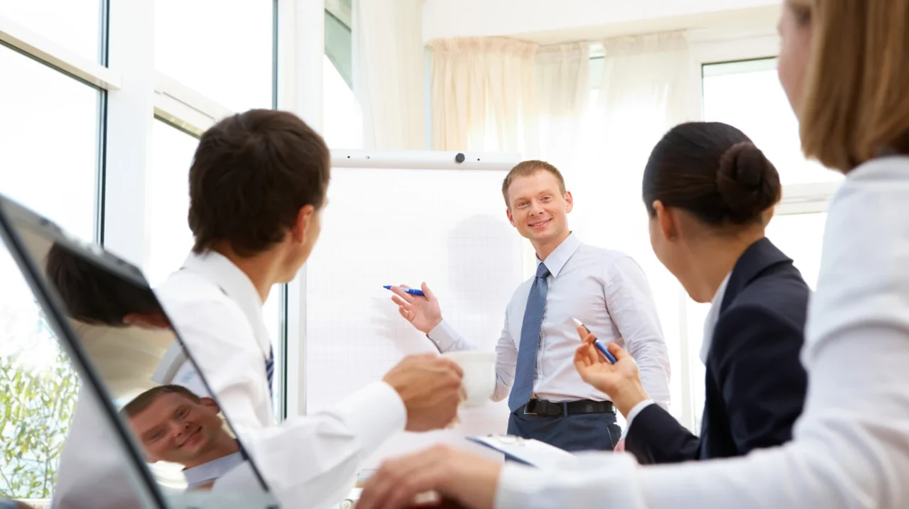Team discussing work in a bright office.