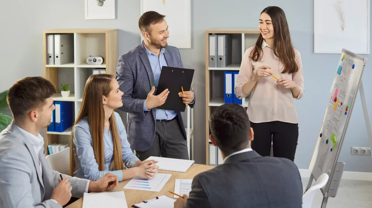 Colleagues presenting a plan to a team.