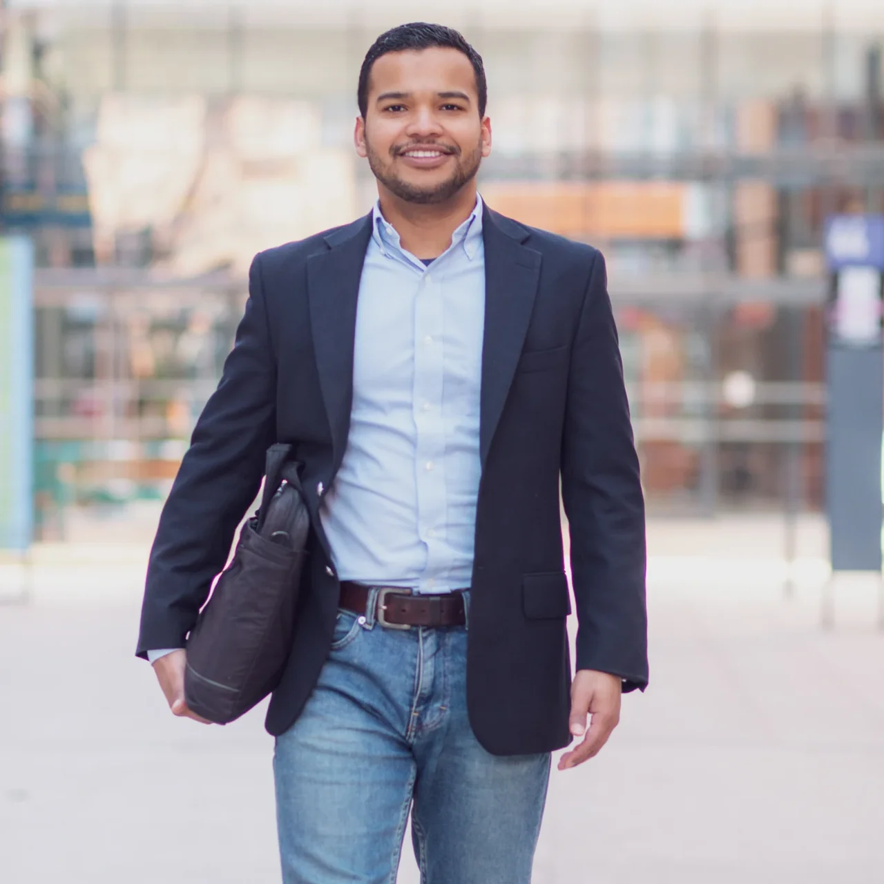 Professional walking outside an office building.