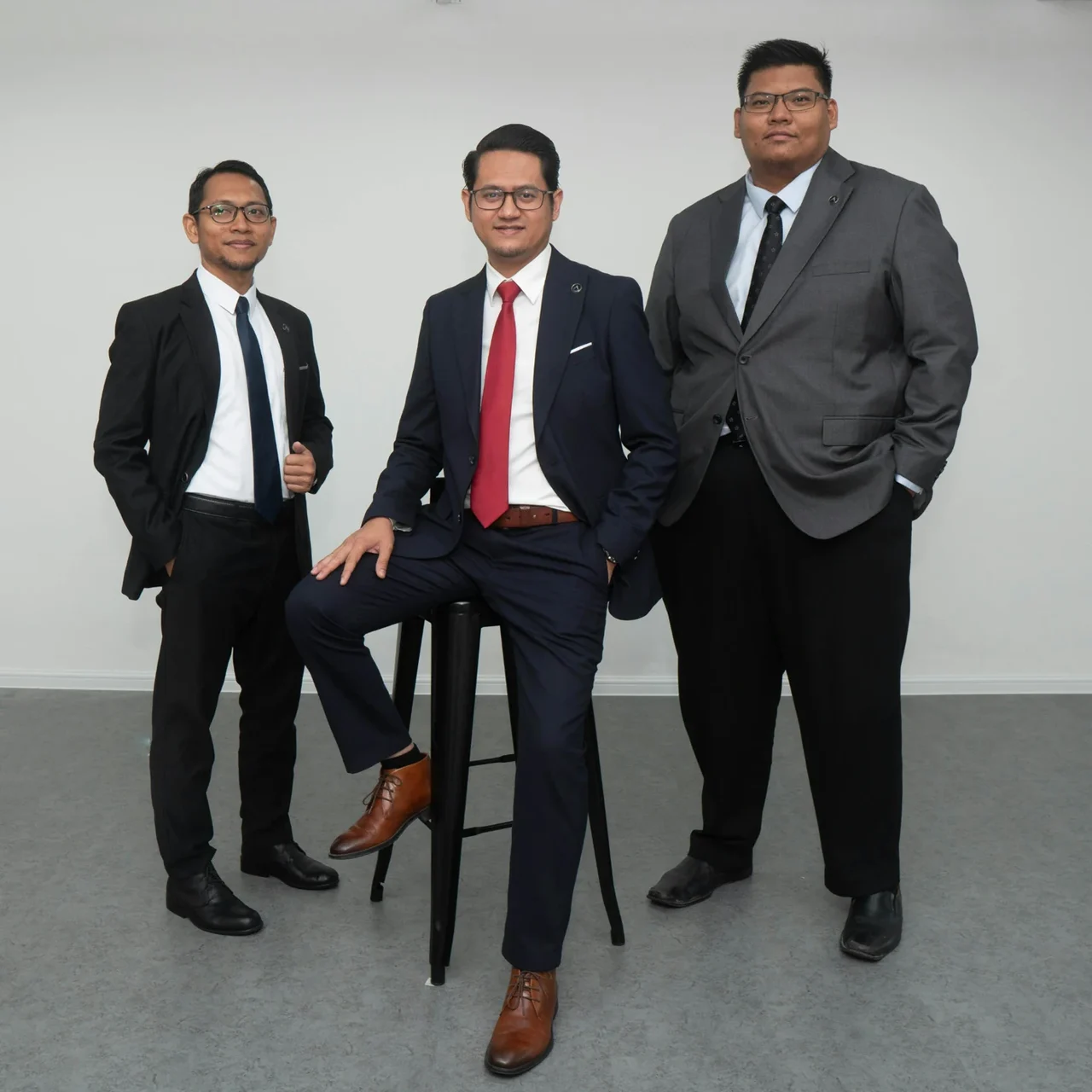 Three professionals standing together.