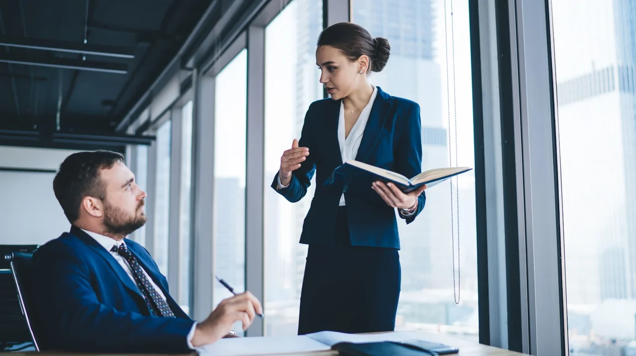 Professional explaining a document to a colleague.