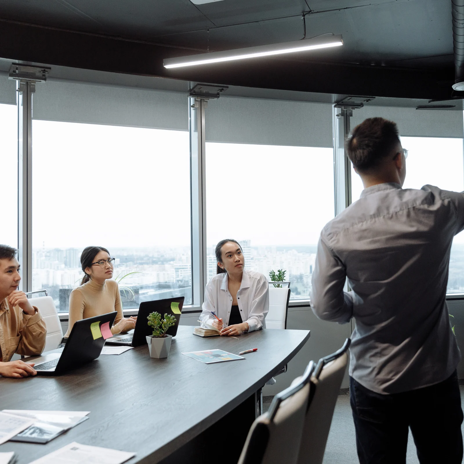 Instructor guiding a cybersecurity team through applied work